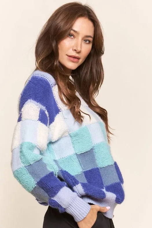 Blue and Teal Checkered Knit Sweater.