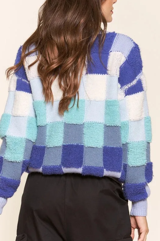Blue and Teal Checkered Knit Sweater.