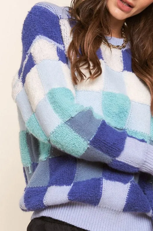 Blue and Teal Checkered Knit Sweater.